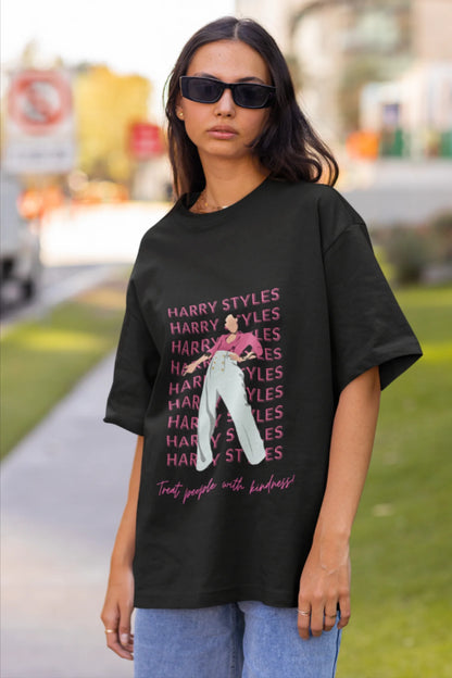 Second image of female model wearing black oversized t-shirt inspired by Harry Styles, featuring the 'Treat People with Kindness' mantra from the Fine Line collection.