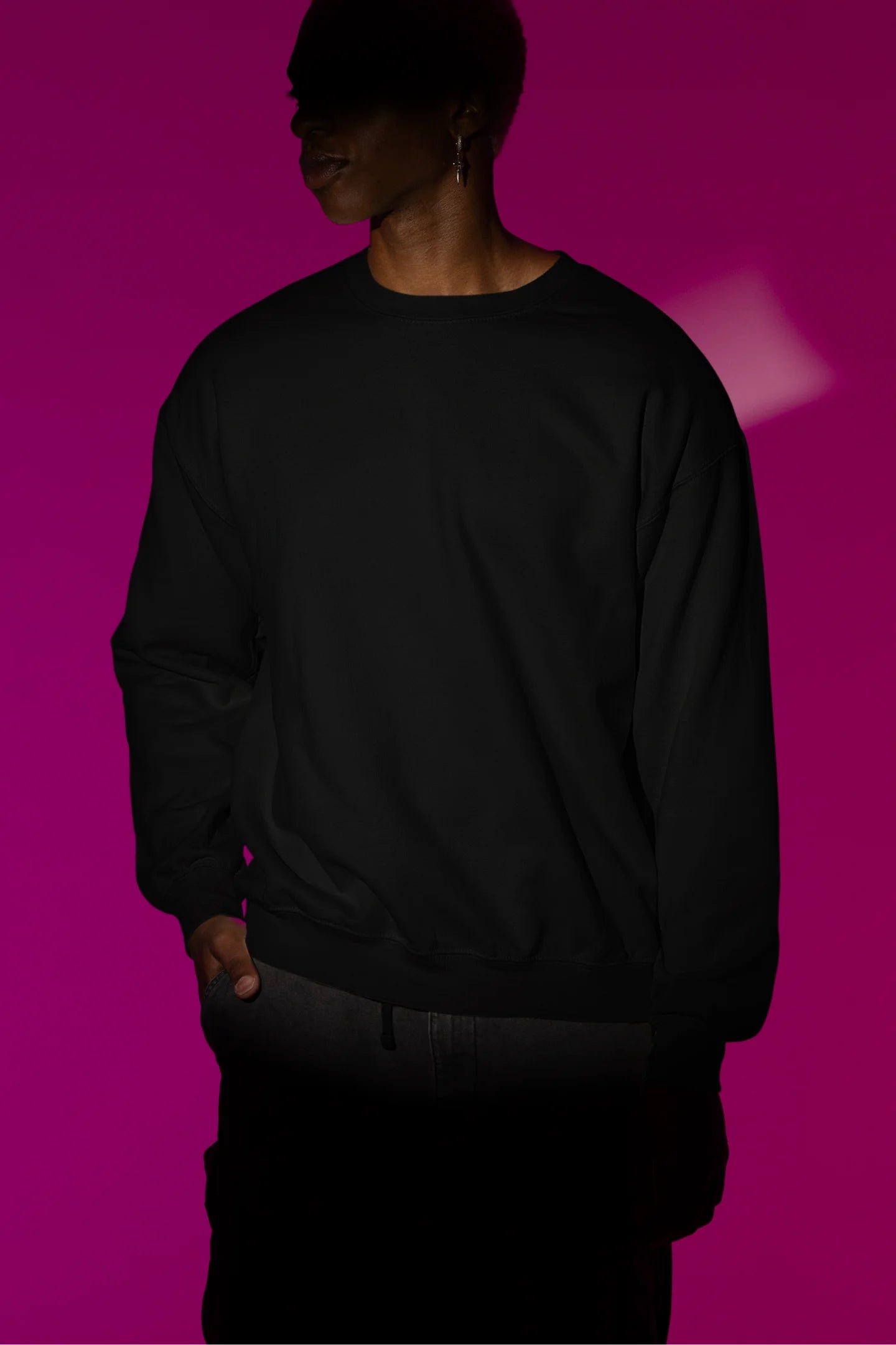 Second front view male model wearing a black sweatshirt with a design of a fox and its cub in a traditional Japanese landscape.