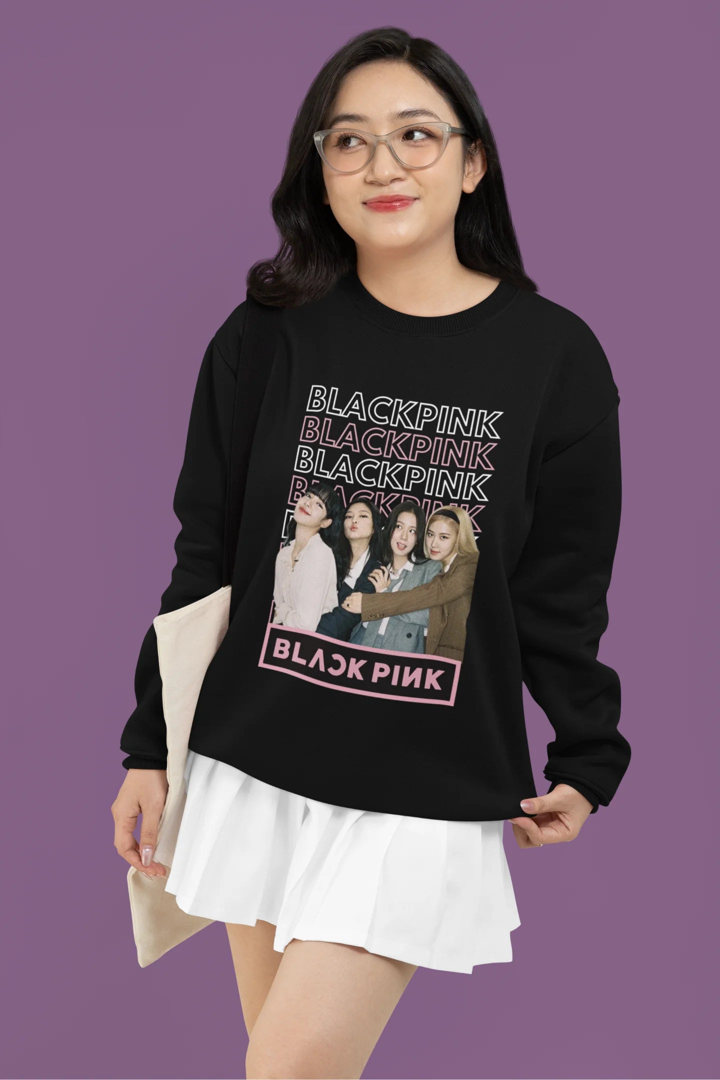 First front view of a female model wearing a black sweatshirt featuring a stylish design inspired by the K-Pop girl group Blackpink. Ideal for Blinks (Blackpink fans) and K-Pop music enthusiasts.