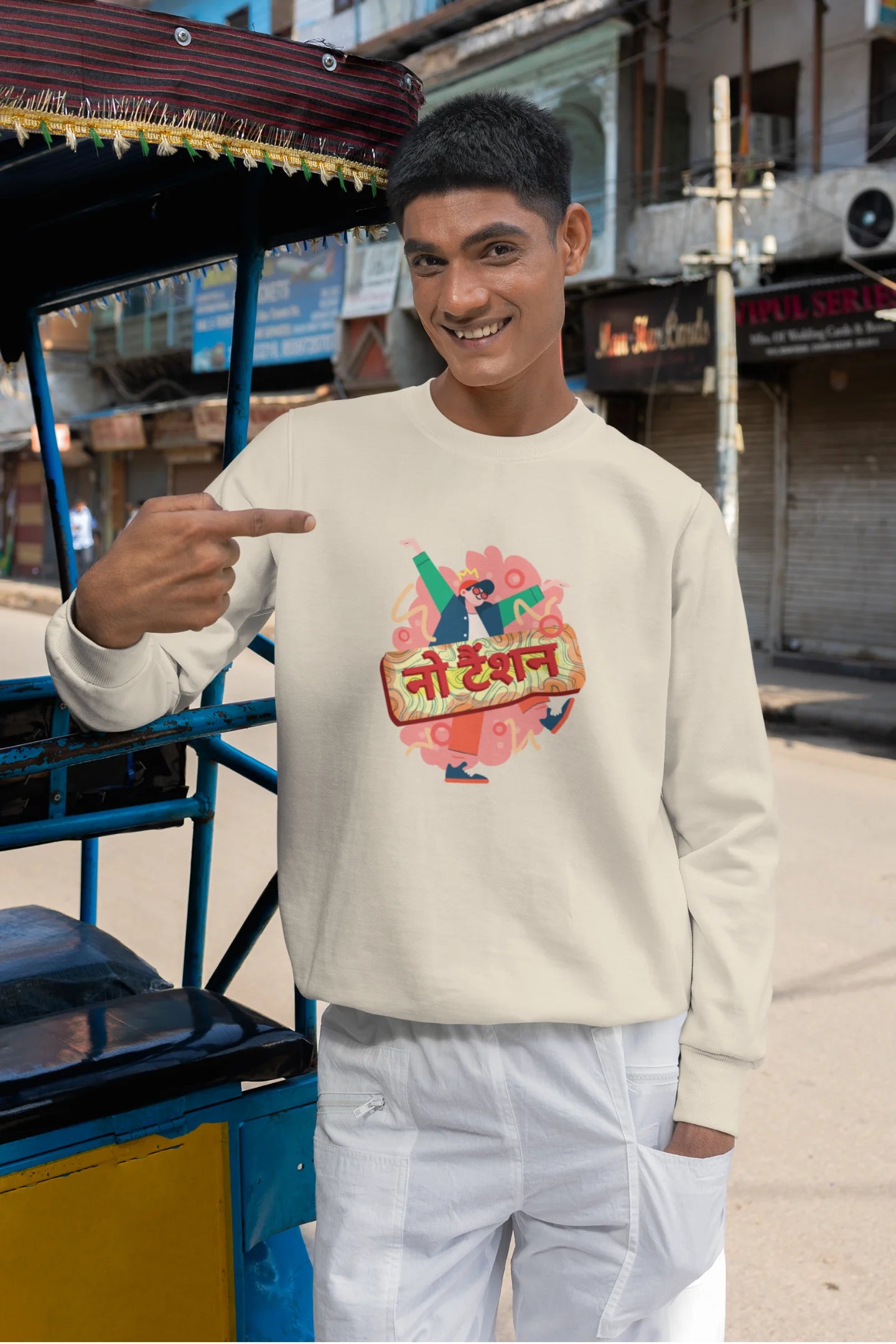 2nd front view of a male model wearing a cream oversized t-shirt with the phrase "No Tension" in a relaxed, unique script.