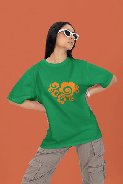 Front view of a female model wearing a forest green oversized t-shirt featuring "Bindass" in a stylish Hindi font.