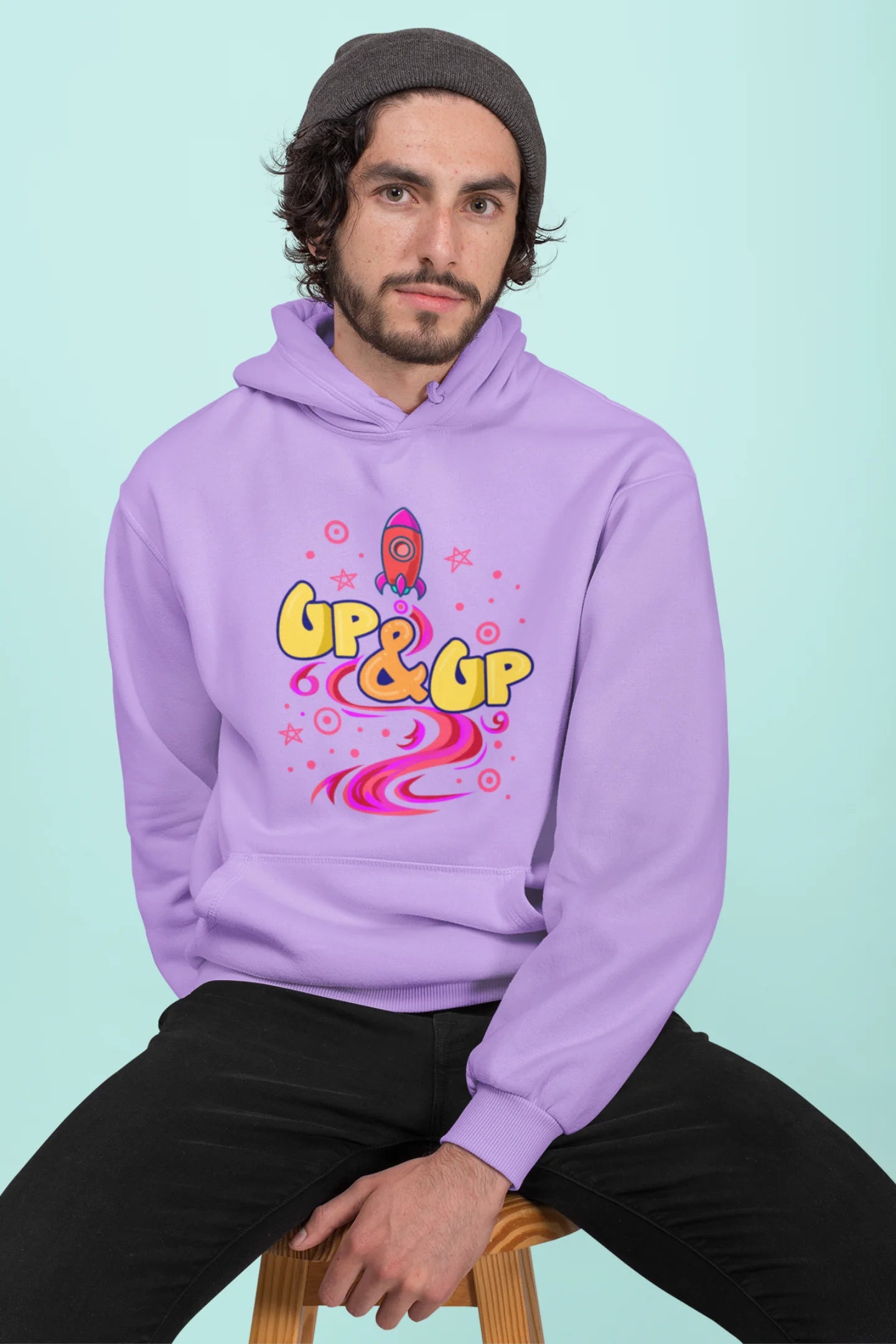 Second front view of a male model wearing an lavender hoodie with a rocket ship design and the text "Up & Up".