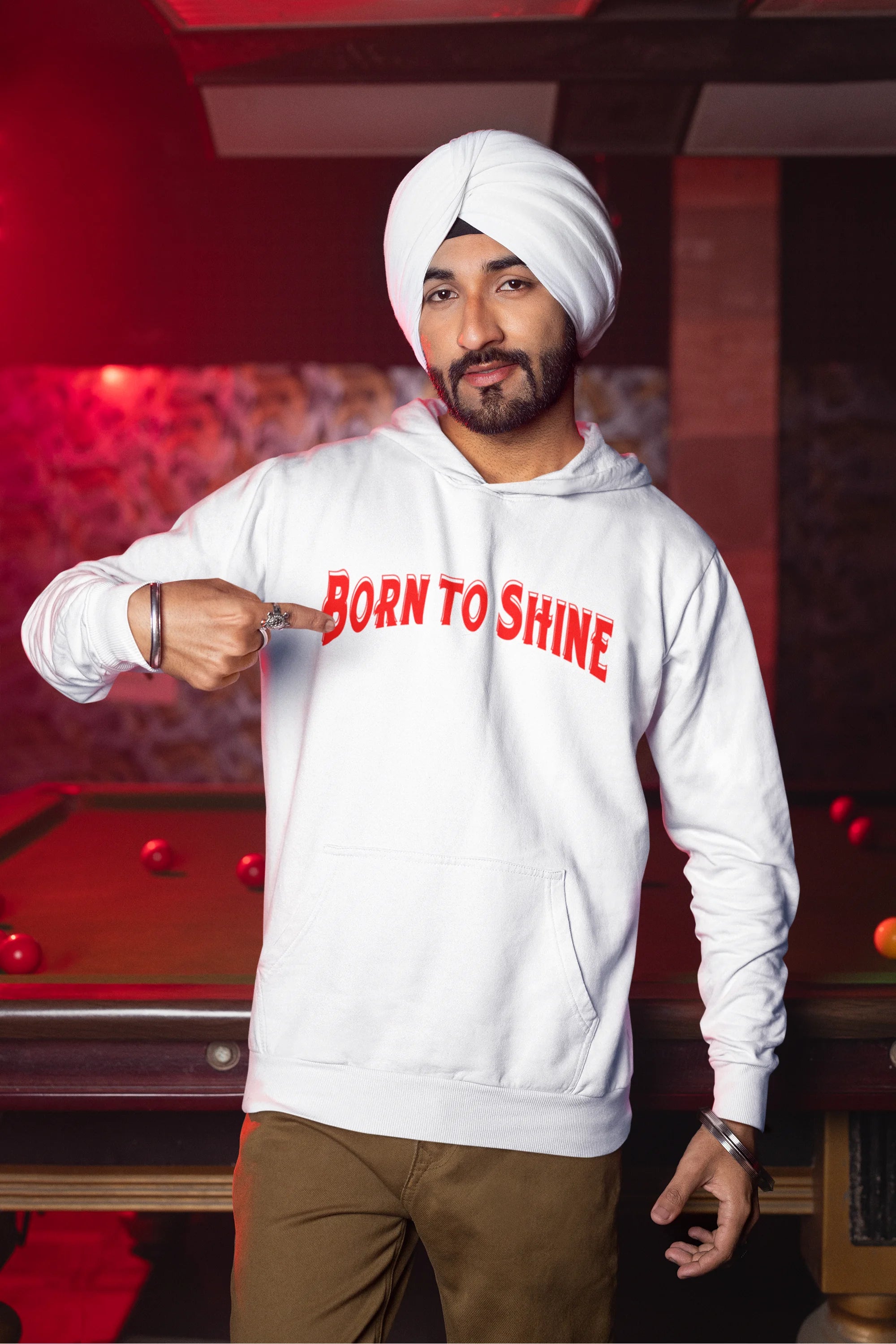 First image of a male model wearing a off-white Diljit Dosanjh hoodie with the text "Born to Shine."