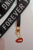 Second image of an keychain featuring the Taylor Swift phrase 