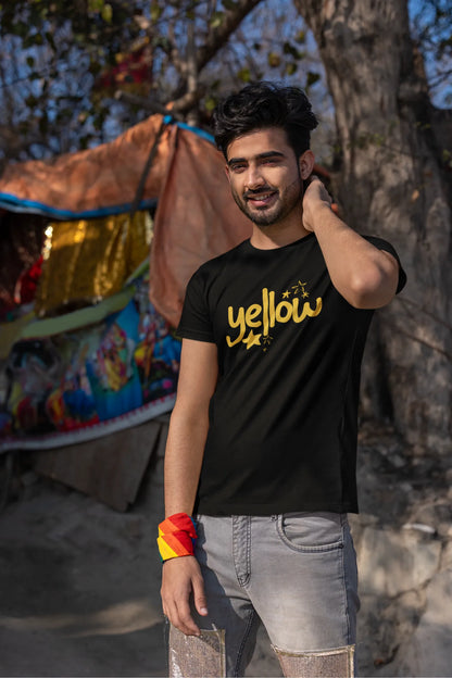 First front view of a male model wearing a black oversized t-shirt with the "Yellow" album artwork by Coldplay.