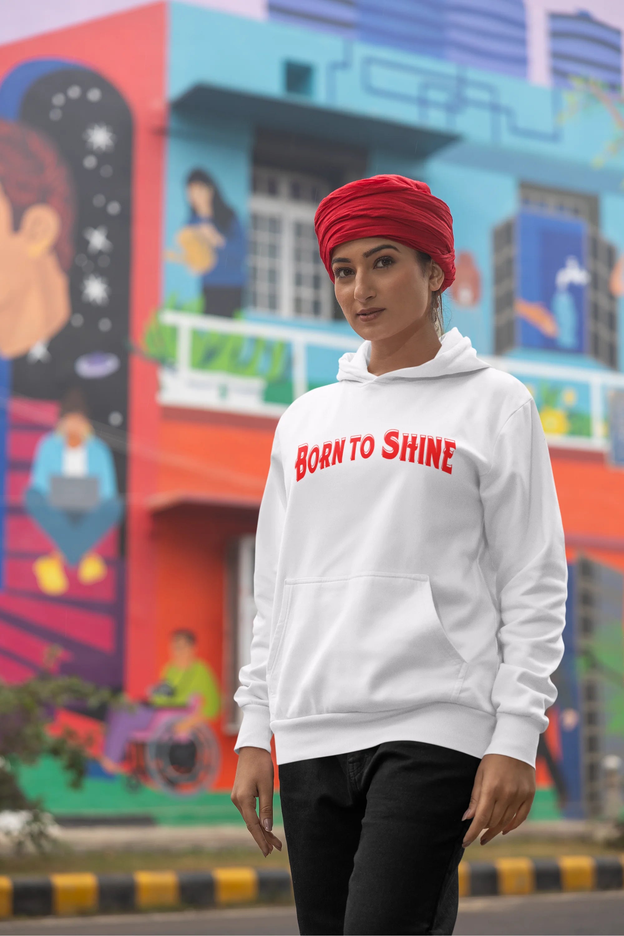 Fourth image of a female model wearing a off-white Diljit Dosanjh hoodie with the text "Born to Shine."