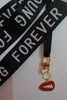 First image of an keychain featuring the Taylor Swift phrase 