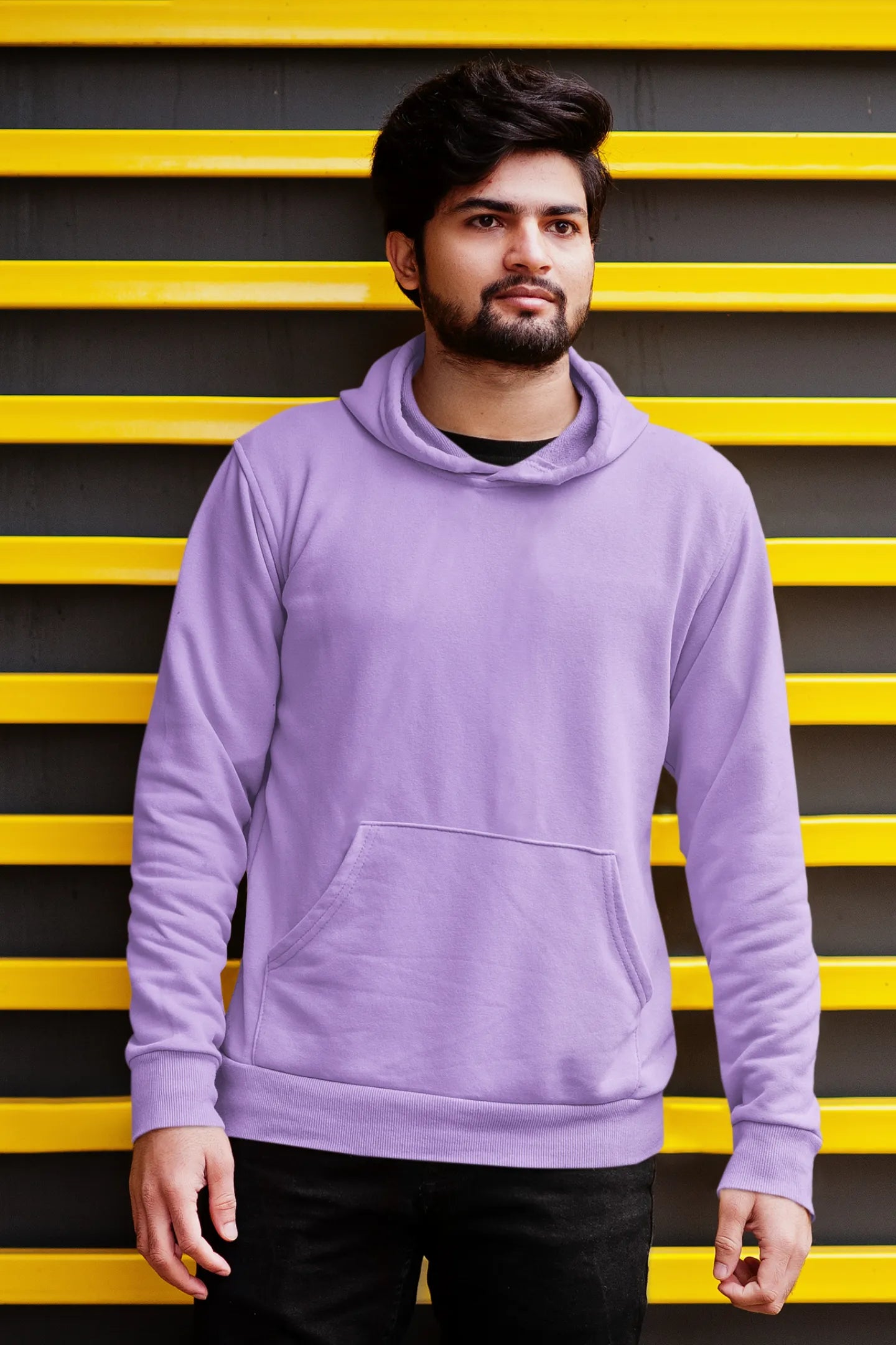 Third front view of a male model wearing a lavender hoodie with a panda fox surrounded by bamboo.