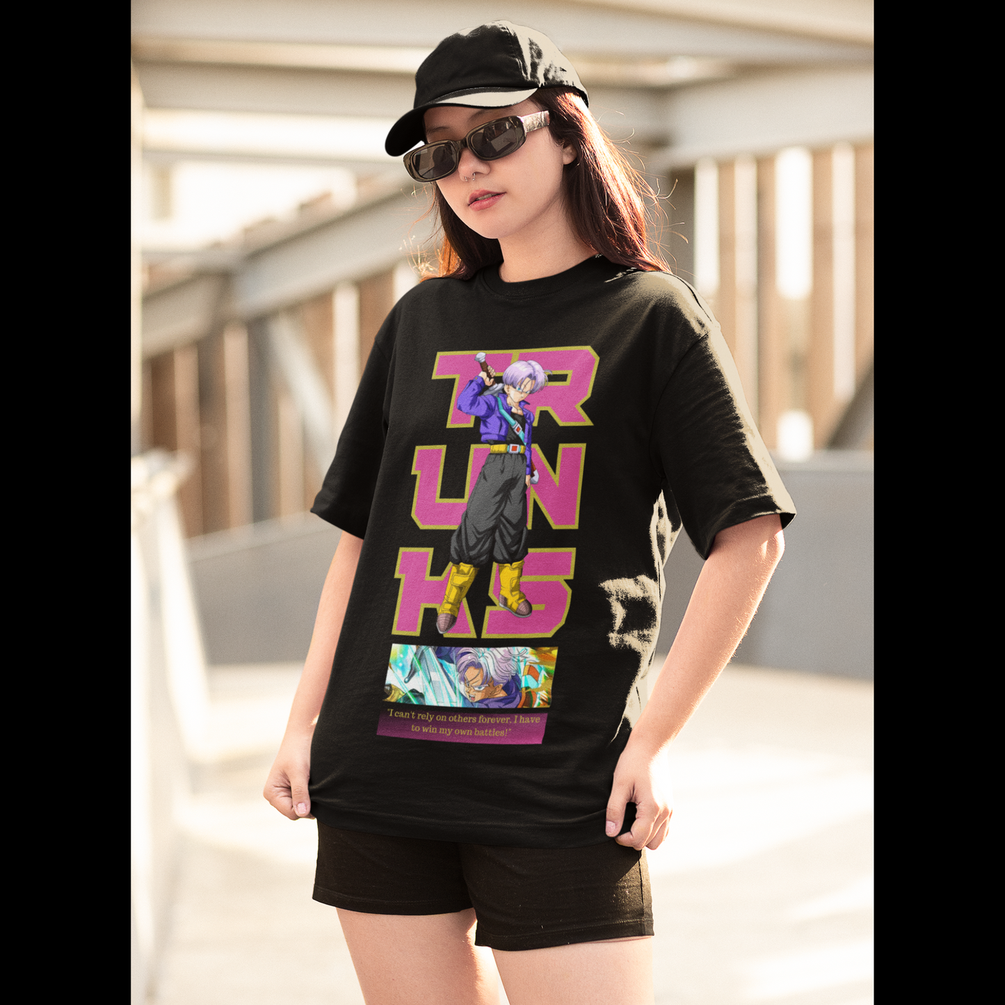 2nd front view of a female model wearing a black oversized t-shirt featuring Trunks from Dragon Ball Z with the text "Trunks."