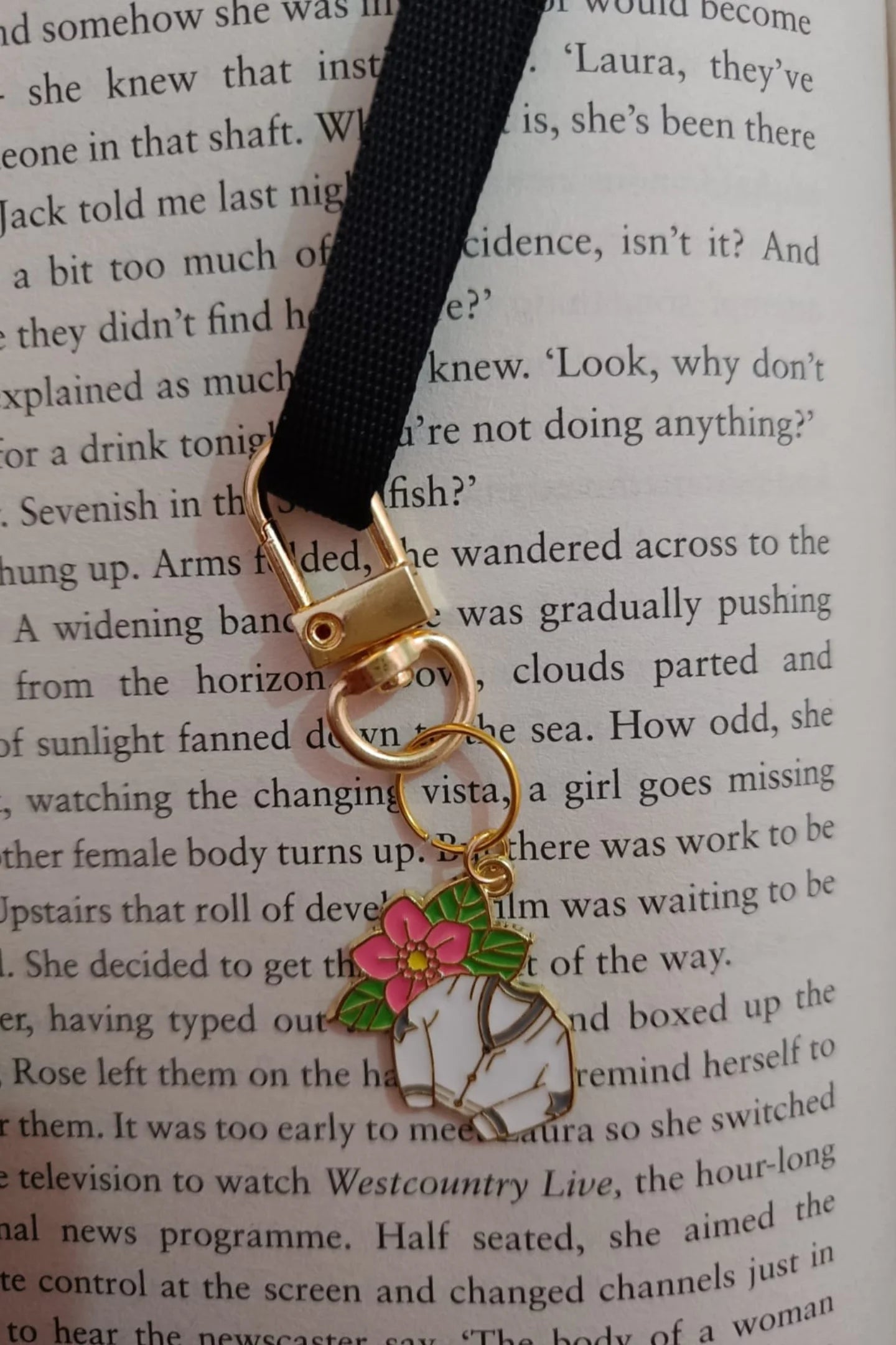 Third view of a cute swiftie keychain featuring a Cardigan design inspired by Taylor Swift's "Folklore" album.