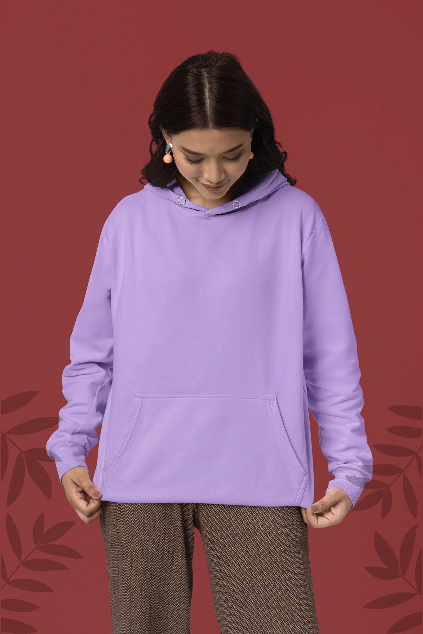 Third front view of a female model wearing a lavender hoodie with a panda fox surrounded by bamboo.