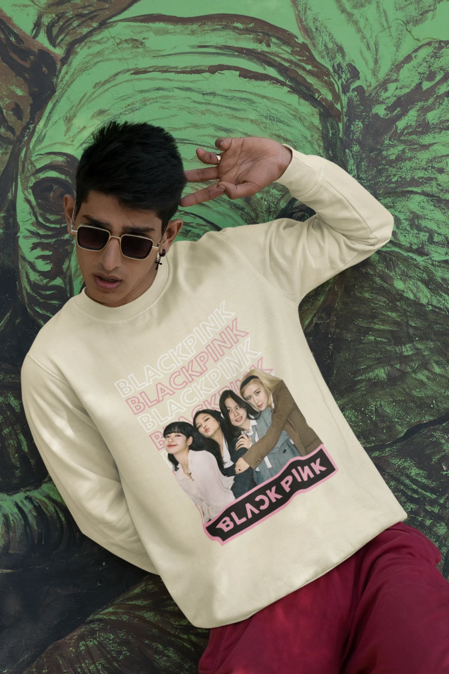 Second front view of a male model wearing a cream sweatshirt featuring a stylish design inspired by the K-Pop girl group Blackpink. Ideal for Blinks (Blackpink fans) and K-Pop music enthusiasts.