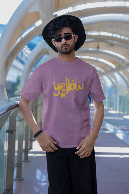 First front view of a male model wearing a dirty purple oversized t-shirt with the "Yellow" album artwork by Coldplay.