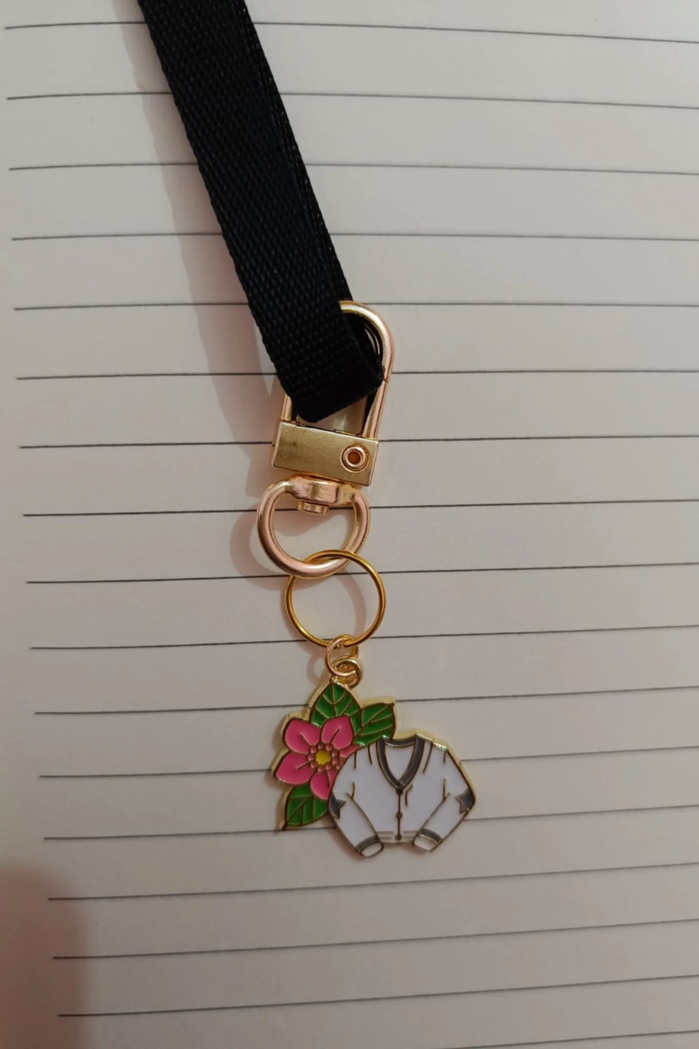 Second view of a cute swiftie keychain featuring a Cardigan design inspired by Taylor Swift's "Folklore" album.