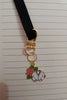 Second view of a cute swiftie keychain featuring a Cardigan design inspired by Taylor Swift's 