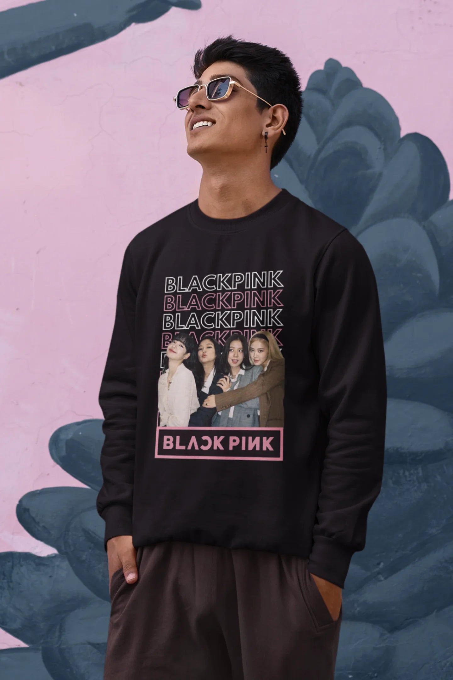 First front view of a male model wearing a black sweatshirt featuring a stylish design inspired by the K-Pop girl group Blackpink. Ideal for Blinks (Blackpink fans) and K-Pop music enthusiasts.