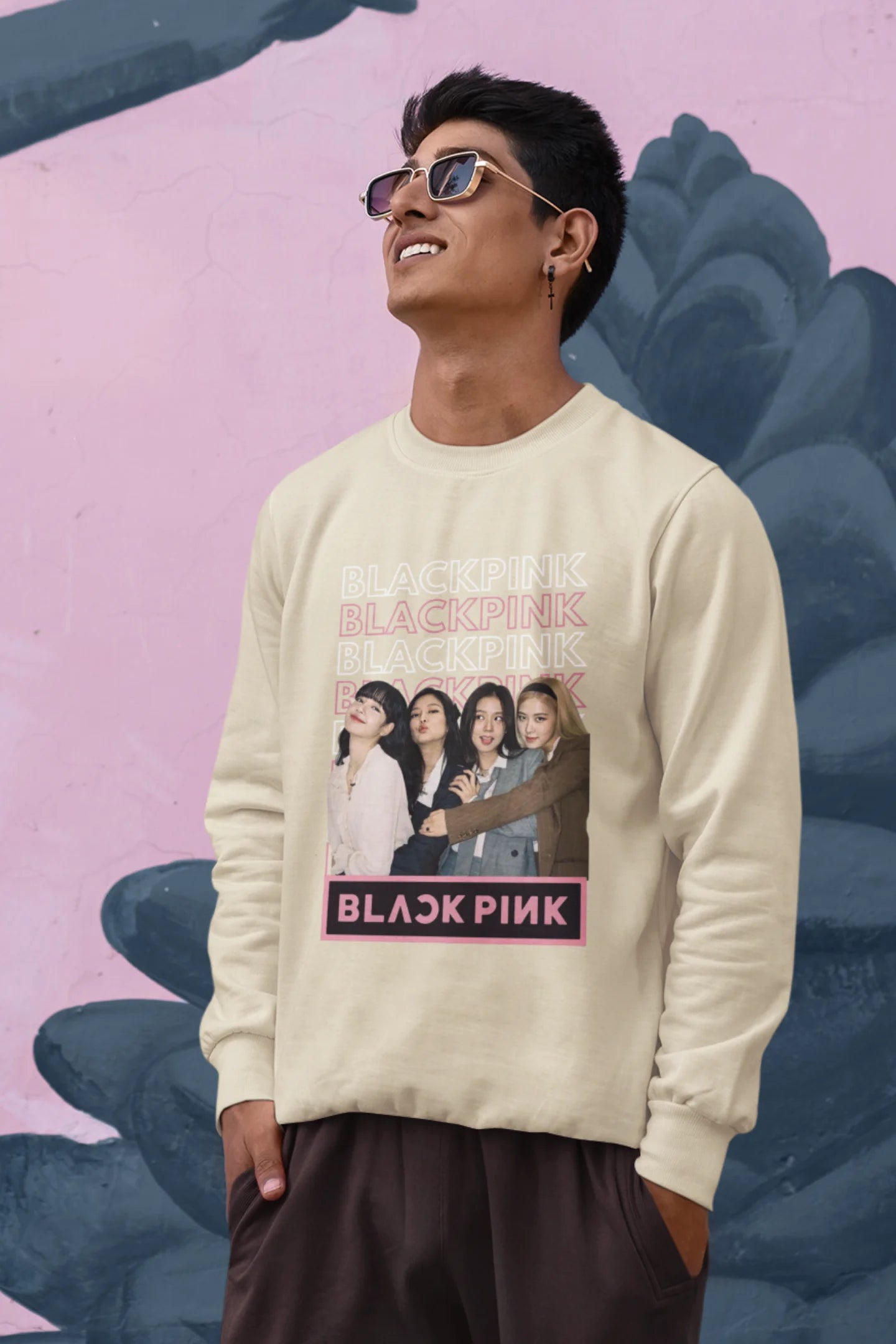 Third front view of a male model wearing a cream sweatshirt featuring a stylish design inspired by the K-Pop girl group Blackpink. Ideal for Blinks (Blackpink fans) and K-Pop music enthusiasts.