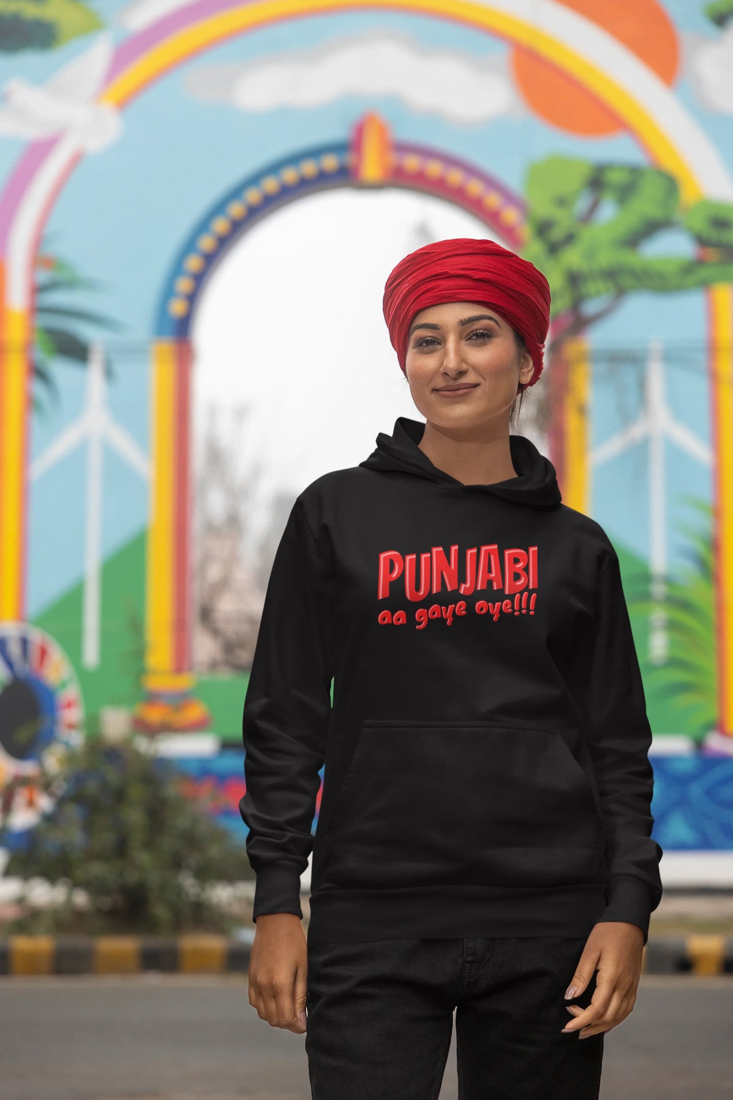 Third front view of a female model wearing an black hoodie with the text "Punjabi Aa Gaye".