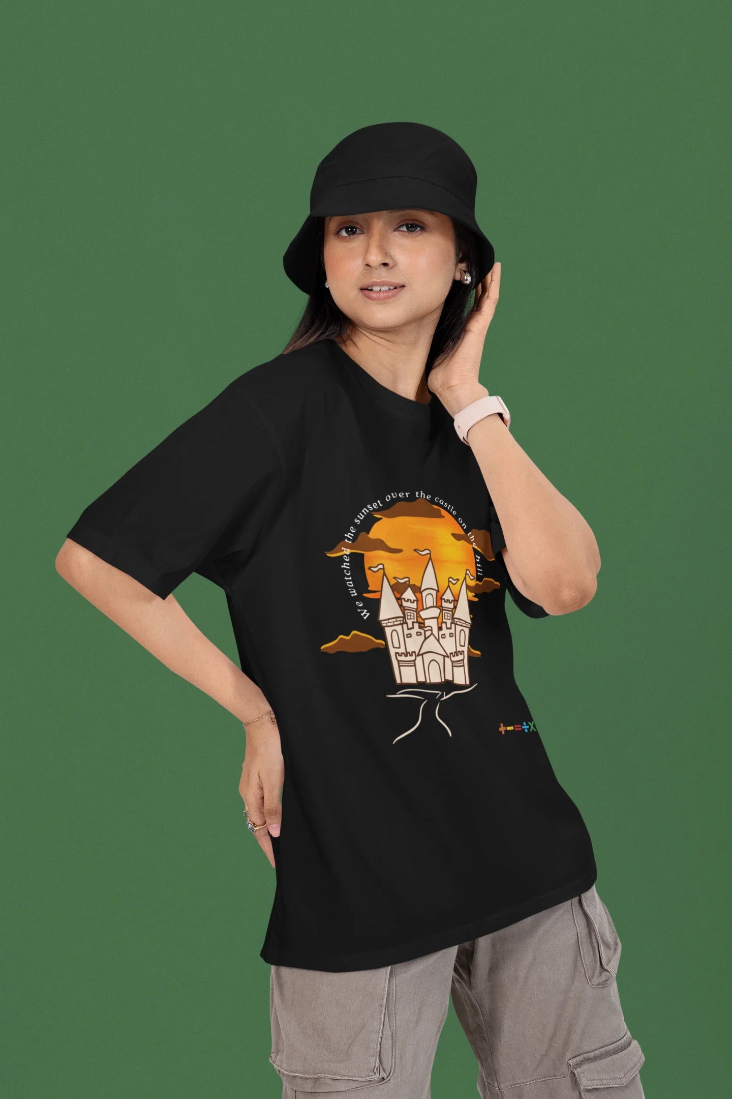 3rd front view of a female model wearing a black oversized t-shirt featuring a nostalgic sunset and castle design, related to Ed Sheeran's "Castle on the Hill."