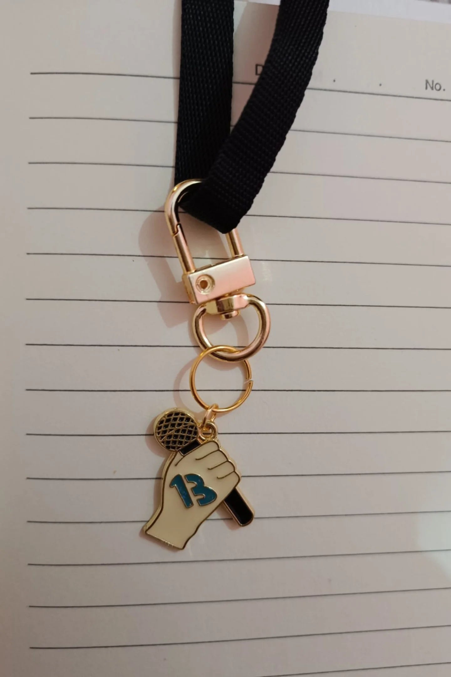 Second view of a keychain featuring the number thirteen, symbolizing Taylor Swift's lucky number.