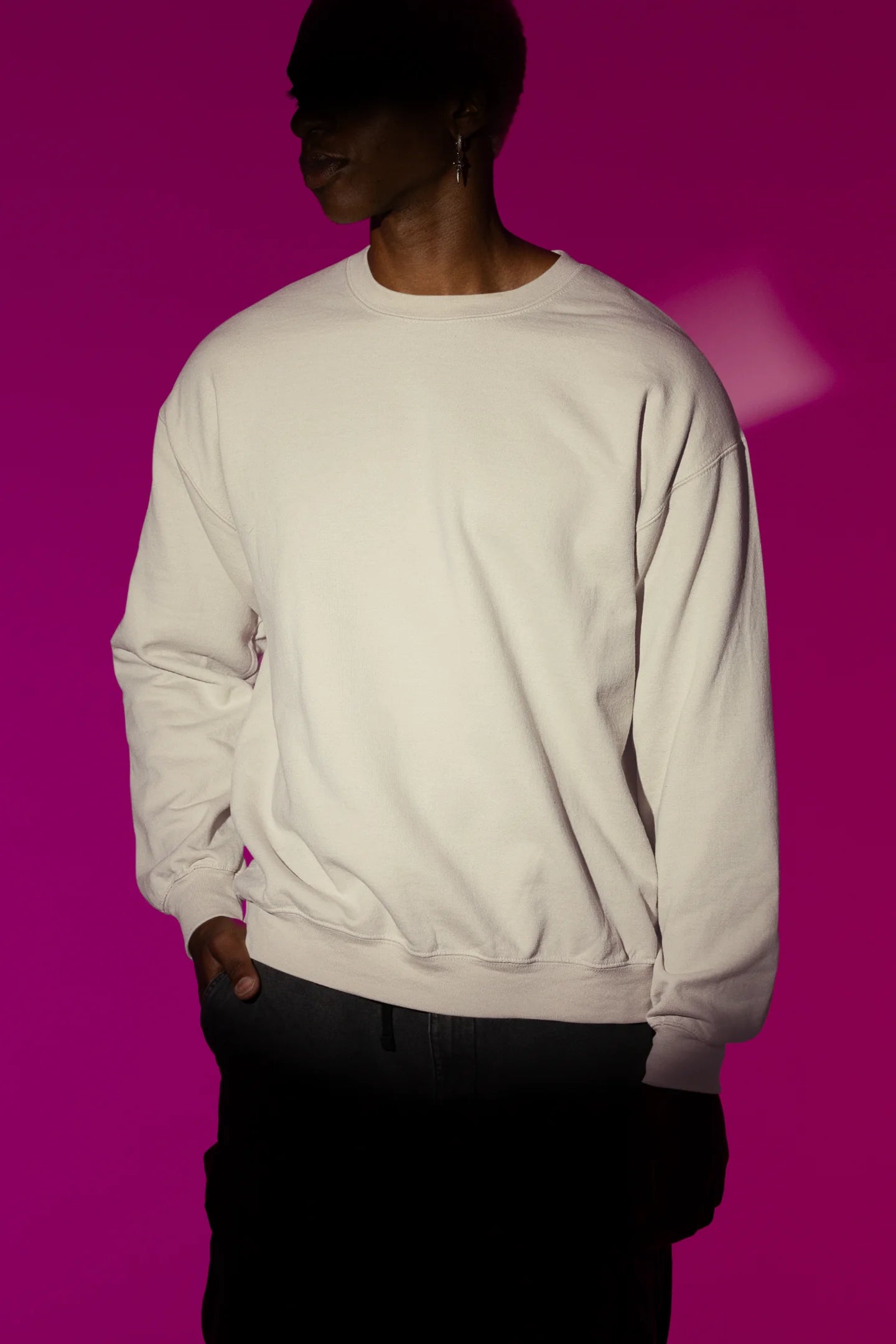First front view male model wearing a cream sweatshirt with a design of a fox and its cub in a traditional Japanese landscape.