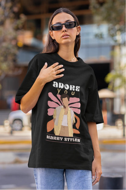 First image of woman wearing black oversized t-shirt featuring 'Adore You' inspired design - ideal for fans of Harry Styles and One Direction