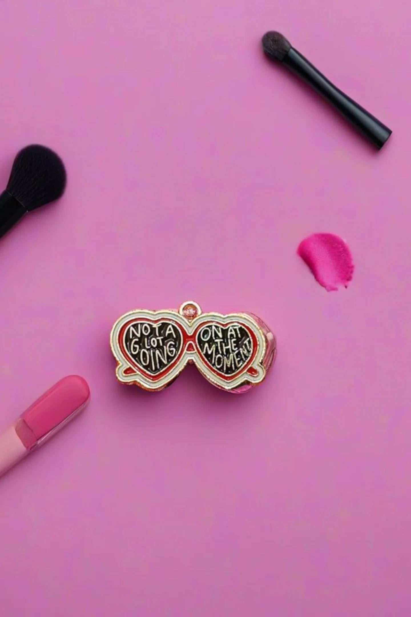 Second view of a charm featuring a design inspired by Taylor Swift's "Evermore" album.