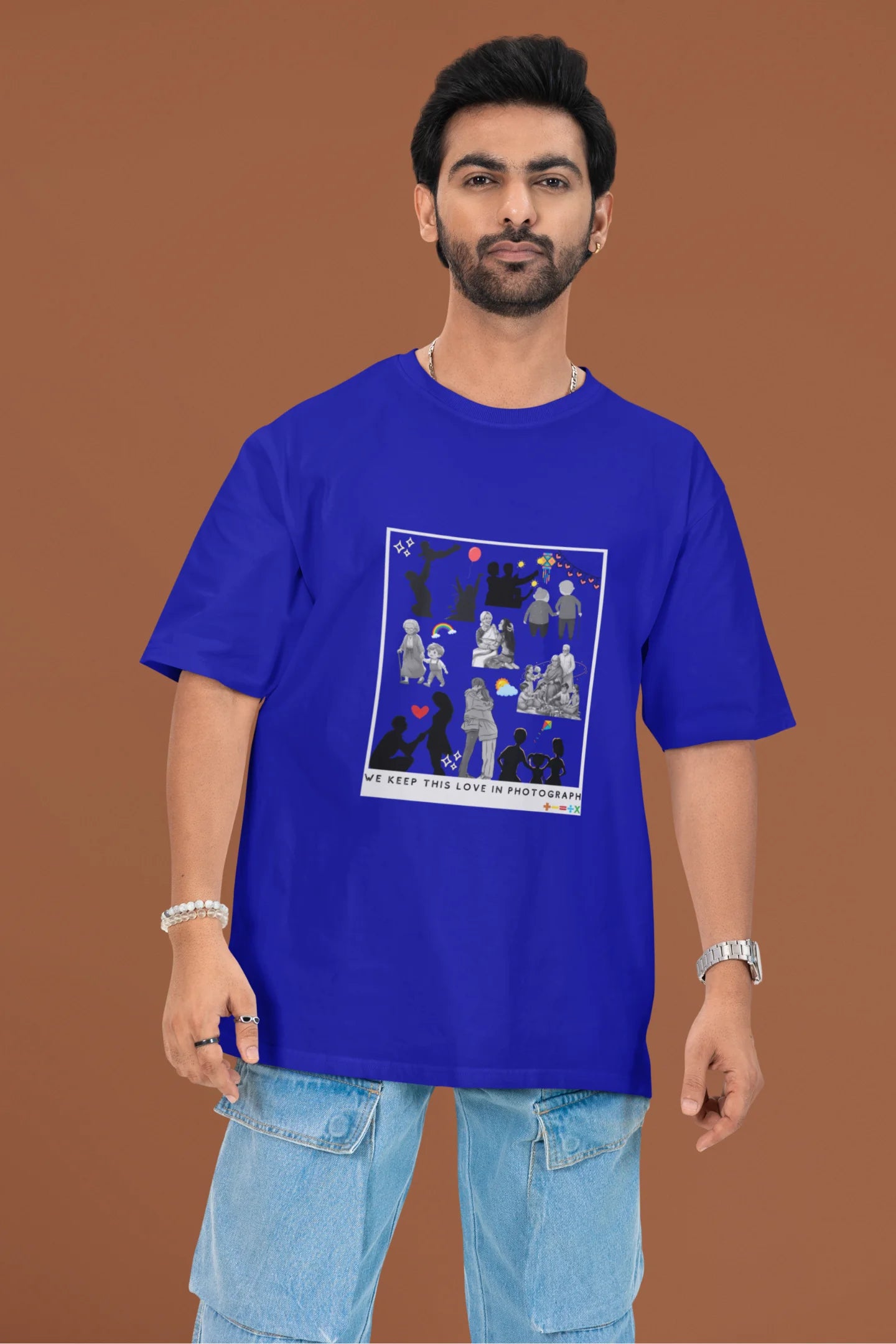 3rd front view of a male model wearing a royal blue oversized t-shirt featuring a design that represents cherished memories, inspired by Ed Sheeran's "Photograph."