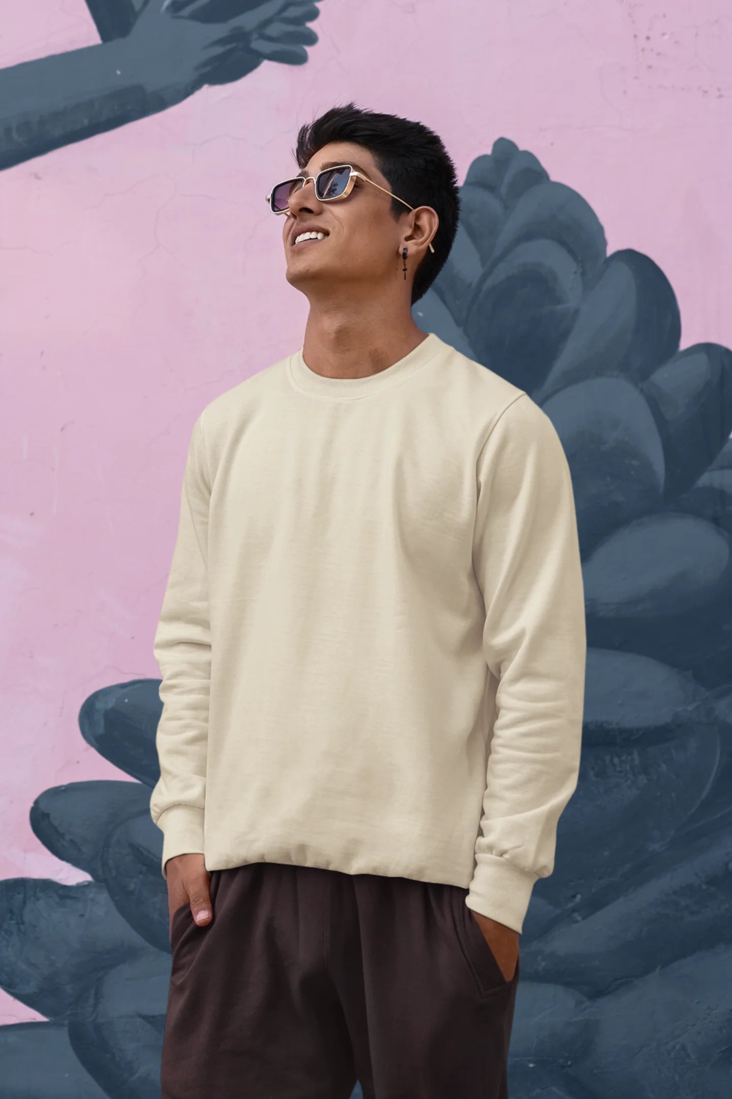 Second front view of a male model wearing a off-cream F.R.I.E.N.D.S. sweatshirt featuring a fun design inspired by Phoebe Buffay and her iconic quotes.