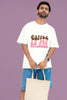 First front view of a male model wearing a white oversized t-shirt with the text 