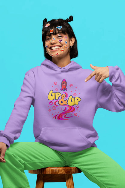 Third front view of a female model wearing an lavender hoodie with a rocket ship design and the text "Up & Up".