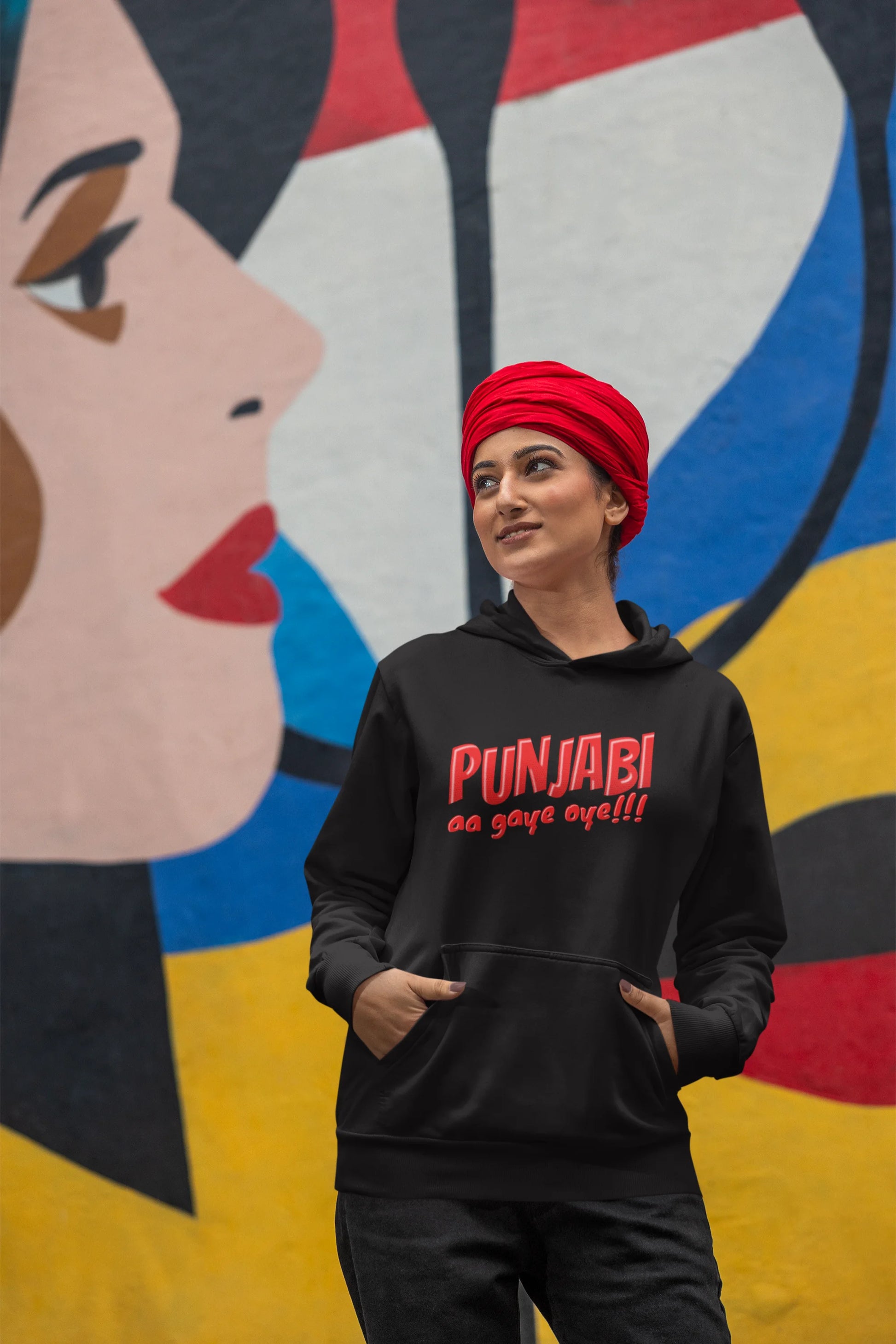 Fourth front view of a female model wearing an black hoodie with the text "Punjabi Aa Gaye".