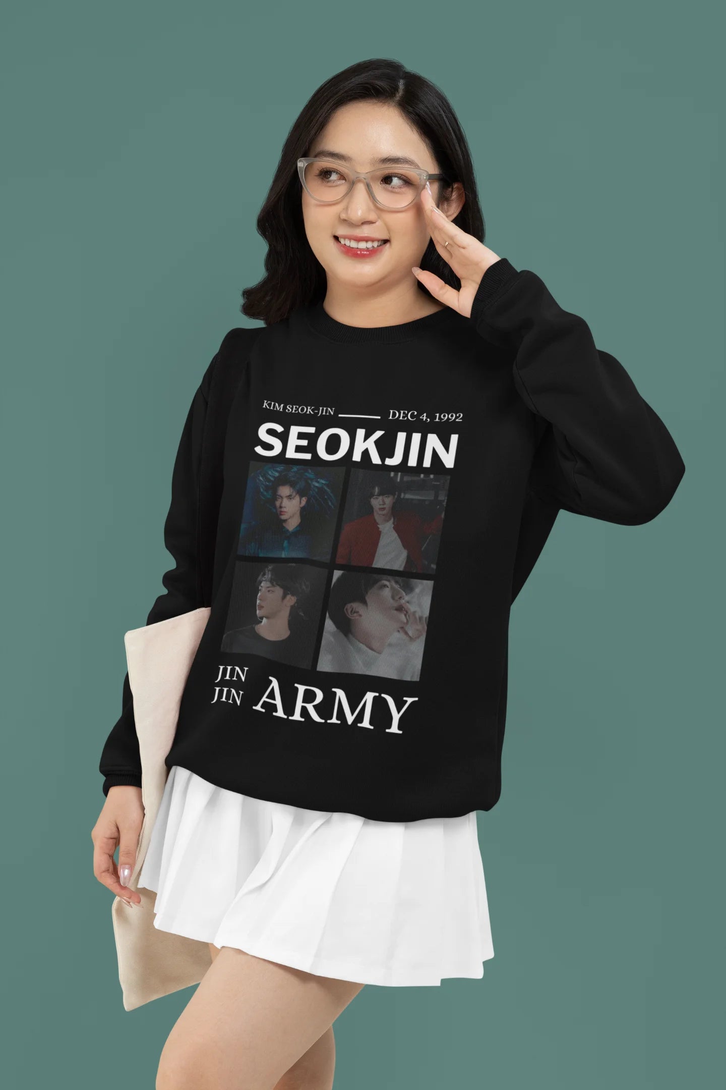Third front view of female model wearing an black sweatshirt featuring a bold design inspired by BTS member Jin. Ideal for BTS fans (ARMY) and K-Pop enthusiasts looking for unique Korean Wave fashion.