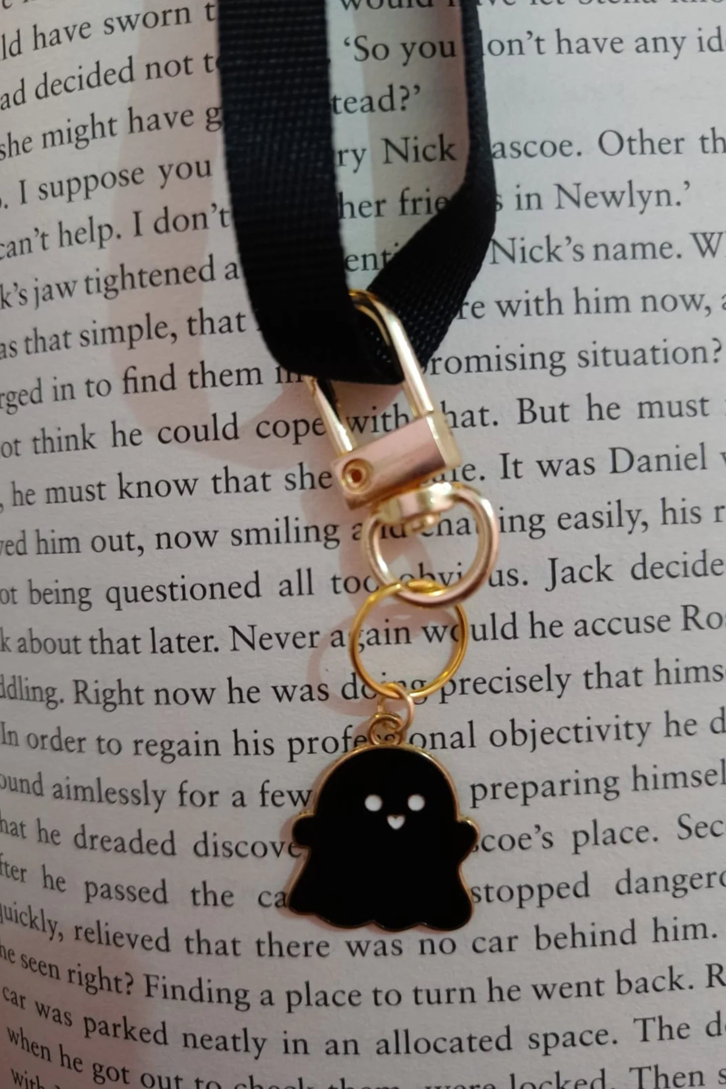 Third view of black colored keychain featuring a cute spooky adorable ghost design.