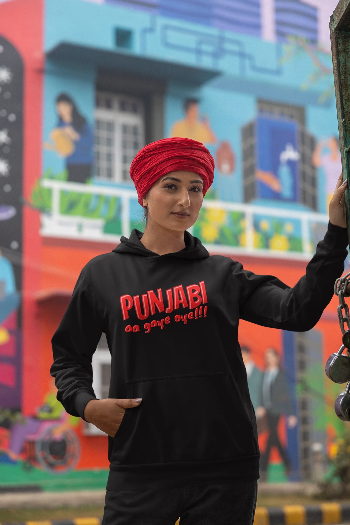 Fifth front view of a female model wearing an black hoodie with the text "Punjabi Aa Gaye".