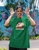 First front view of female model wearing an oversized forest green tee featuring Shinchan with the text 