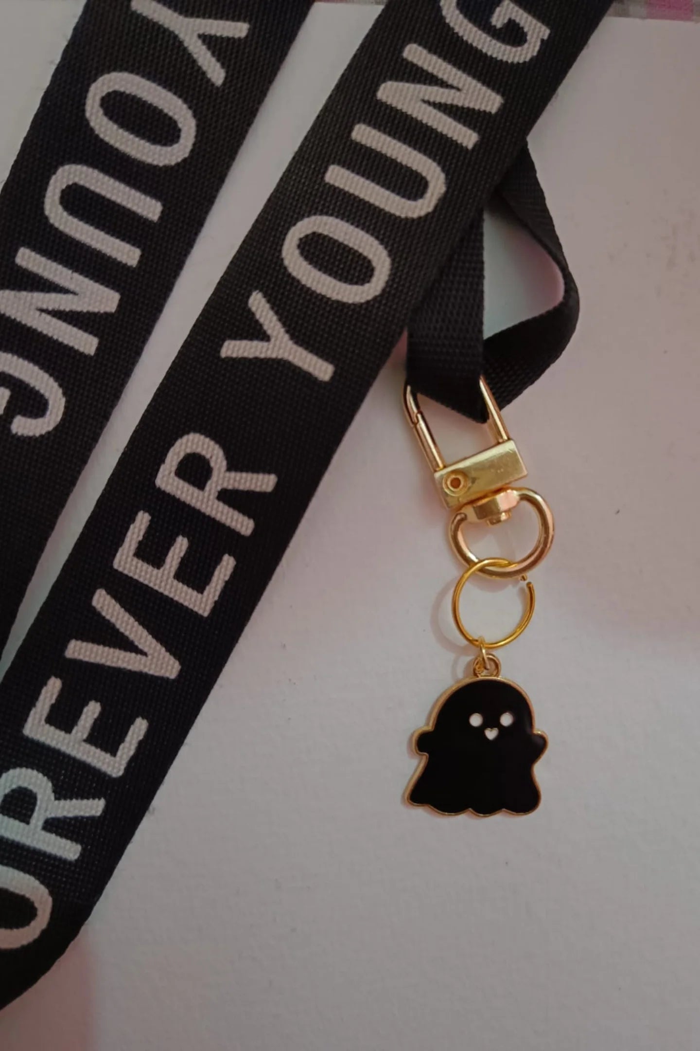 Second view of black colored keychain featuring a cute spooky adorable ghost design.