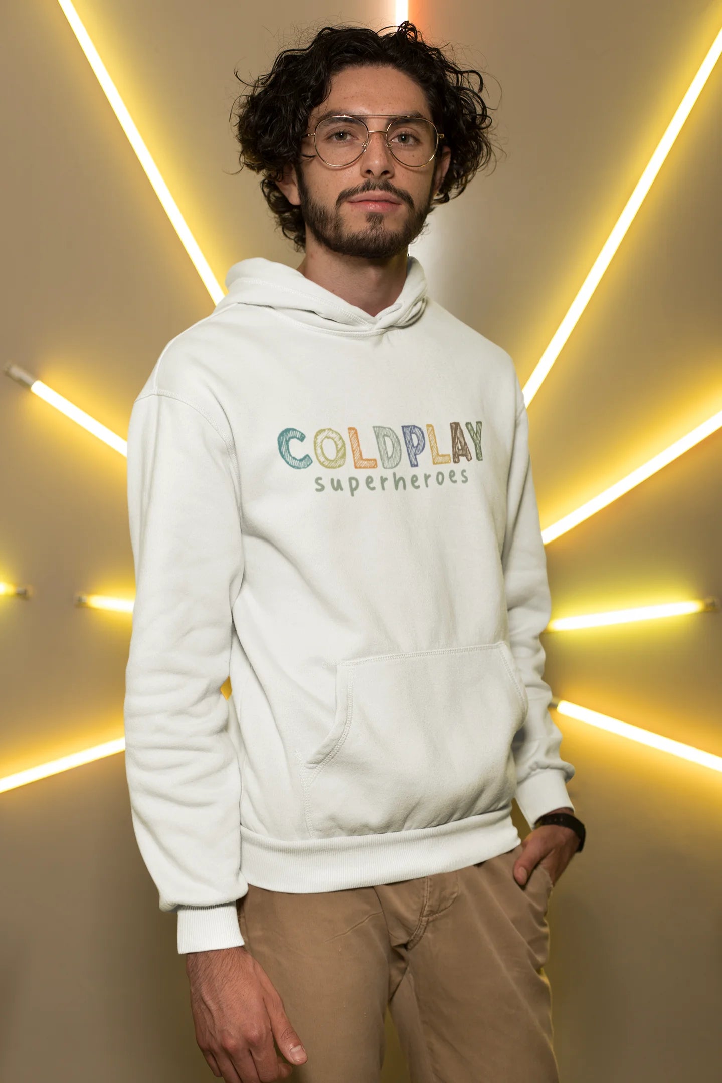 3rd front view of a male model wearing an off-white hoodie with a design inspired by the "Something Just Like This" music video, featuring the word "Superheroes".