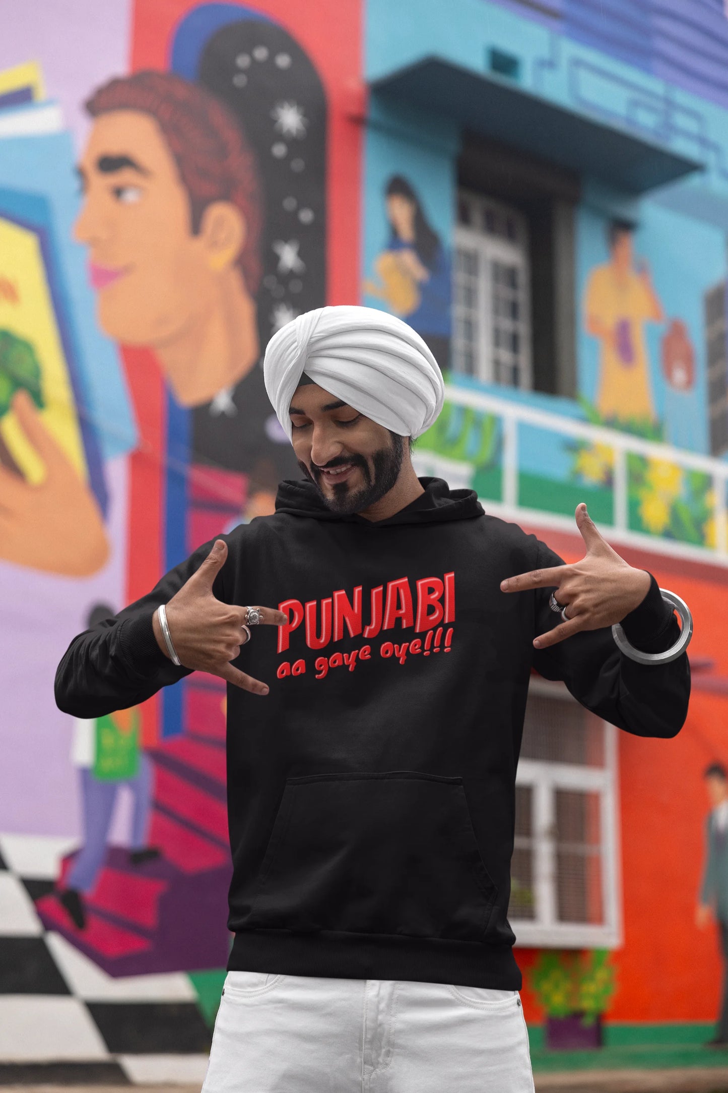 Fourth front view of a male model wearing an black hoodie with the text "Punjabi Aa Gaye".