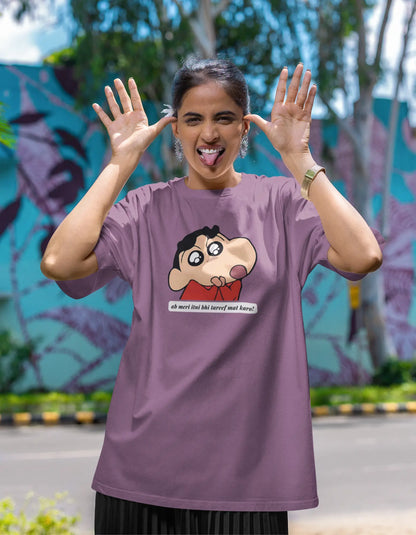 First front view of female model wearing an oversized dirty purple tee featuring Shinchan with the text "Don't Praise Me So Much" in Hindi. A perfect blend of humor and nostalgia for Shinchan fans.