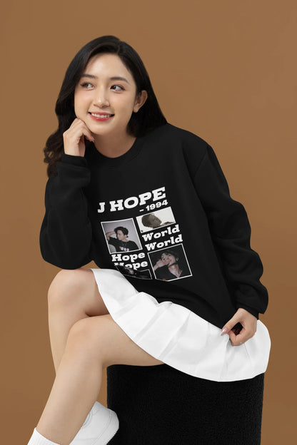 First front view of a female model wearing a black sweatshirt featuring a vibrant design inspired by BTS member J-Hope (Hoseok). Ideal for BTS fans (ARMY) and K-Pop enthusiasts who love dance and rap-focused music.