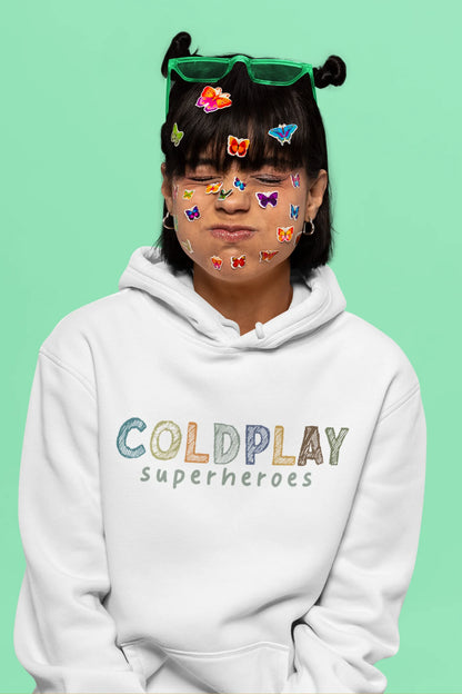 5th front view of a female model wearing an off-white hoodie with a design inspired by the "Something Just Like This" music video, featuring the word "Superheroes".