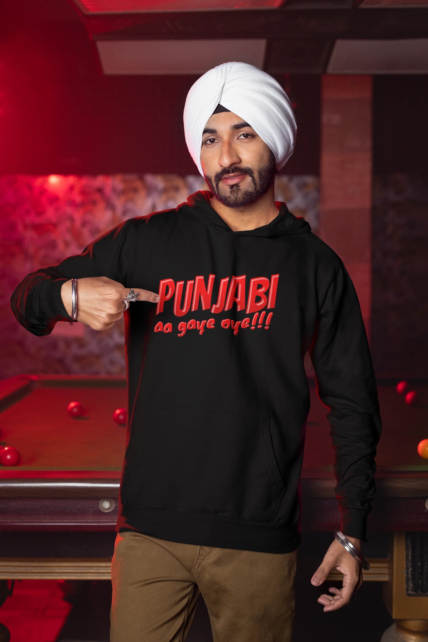 Second front view of a male model wearing an black hoodie with the text "Punjabi Aa Gaye".