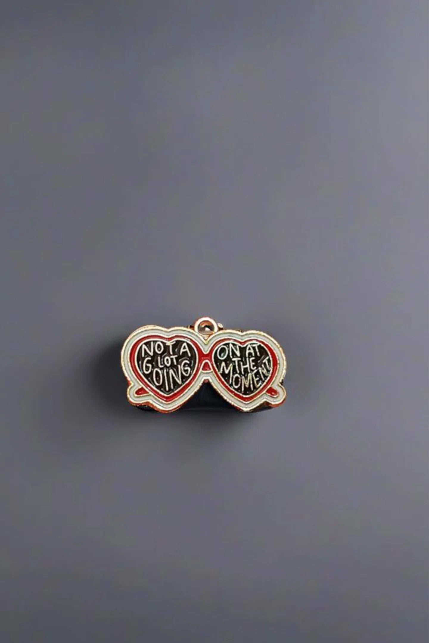 Seventh view of a charm featuring a design inspired by Taylor Swift's "Evermore" album.