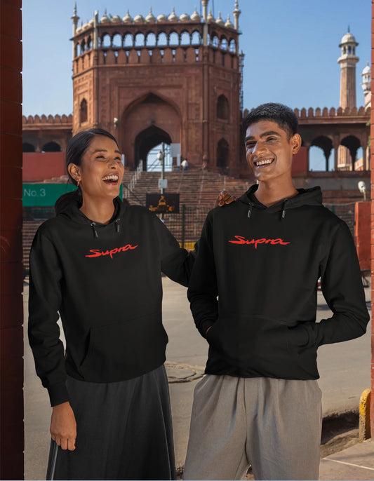 Front view of a female and male model wearing a black hoodie featuring a Toyota Supra design, exuding speed and power.