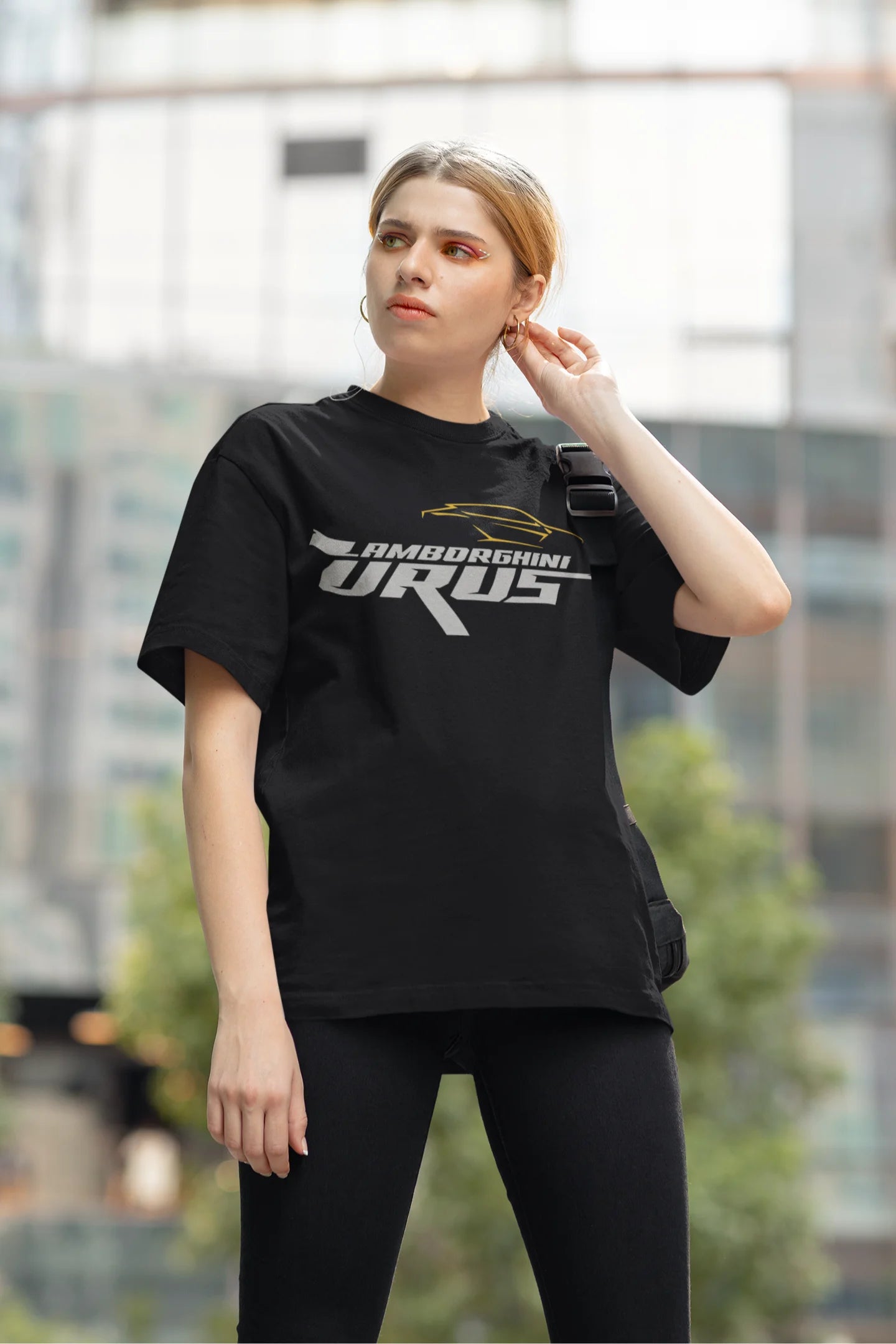 Another front view of a female model wearing a black oversized t-shirt featuring a design of a Lamborghini Urus.