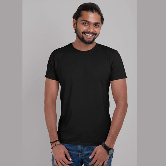 Front view of a male model wearing a black oversized, premium quality, pure cotton t-shirt.