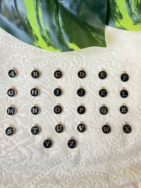First image of charms featuring personalized initials for couples.