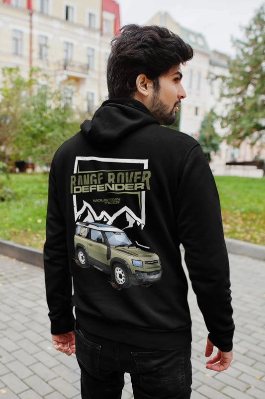 Back view of a male model wearing a black hoodie featuring a Range Rover Defender design, exuding power and ruggedness.