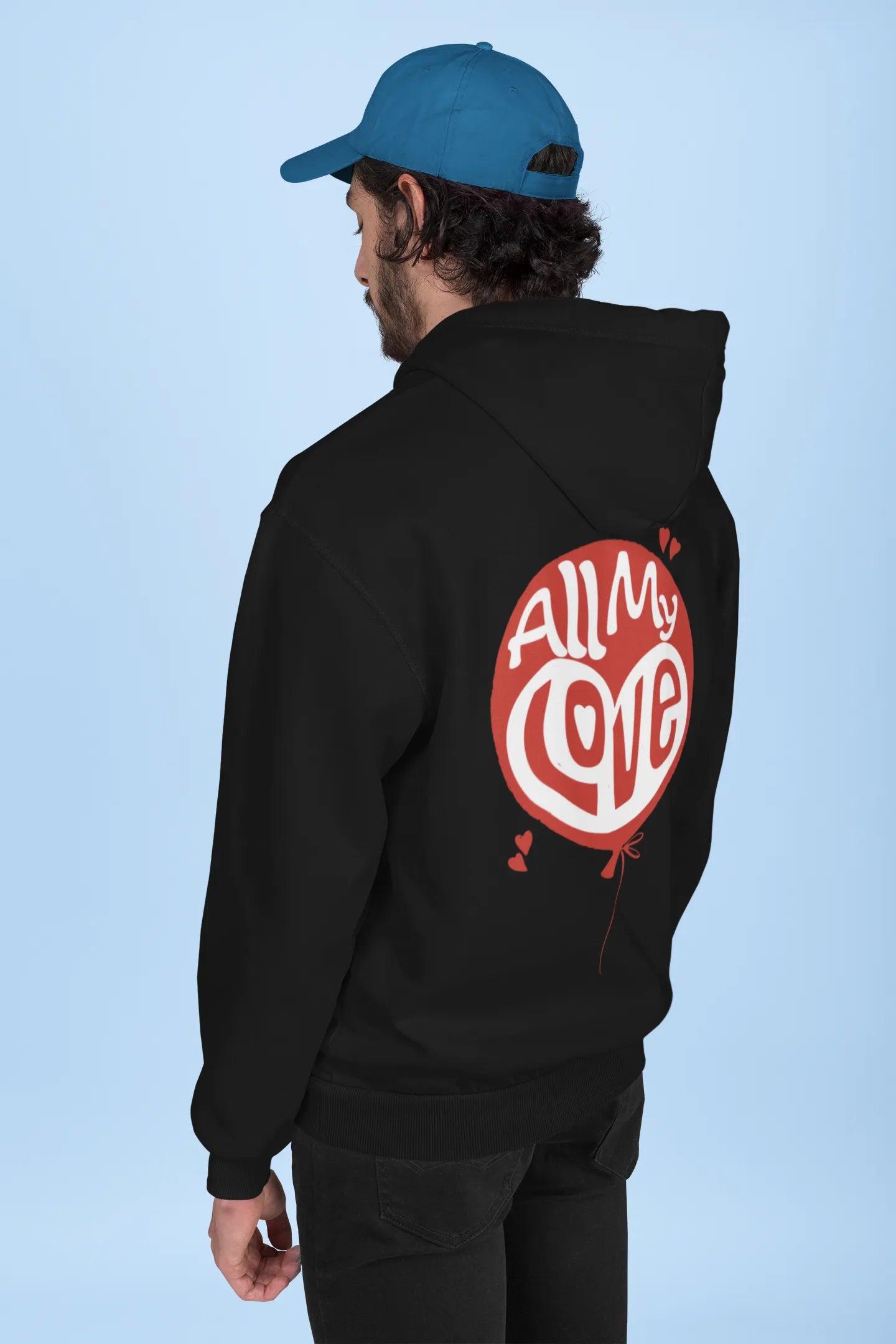 Back view of a male model wearing a black hoodie with a heart design and the text "All My Love".